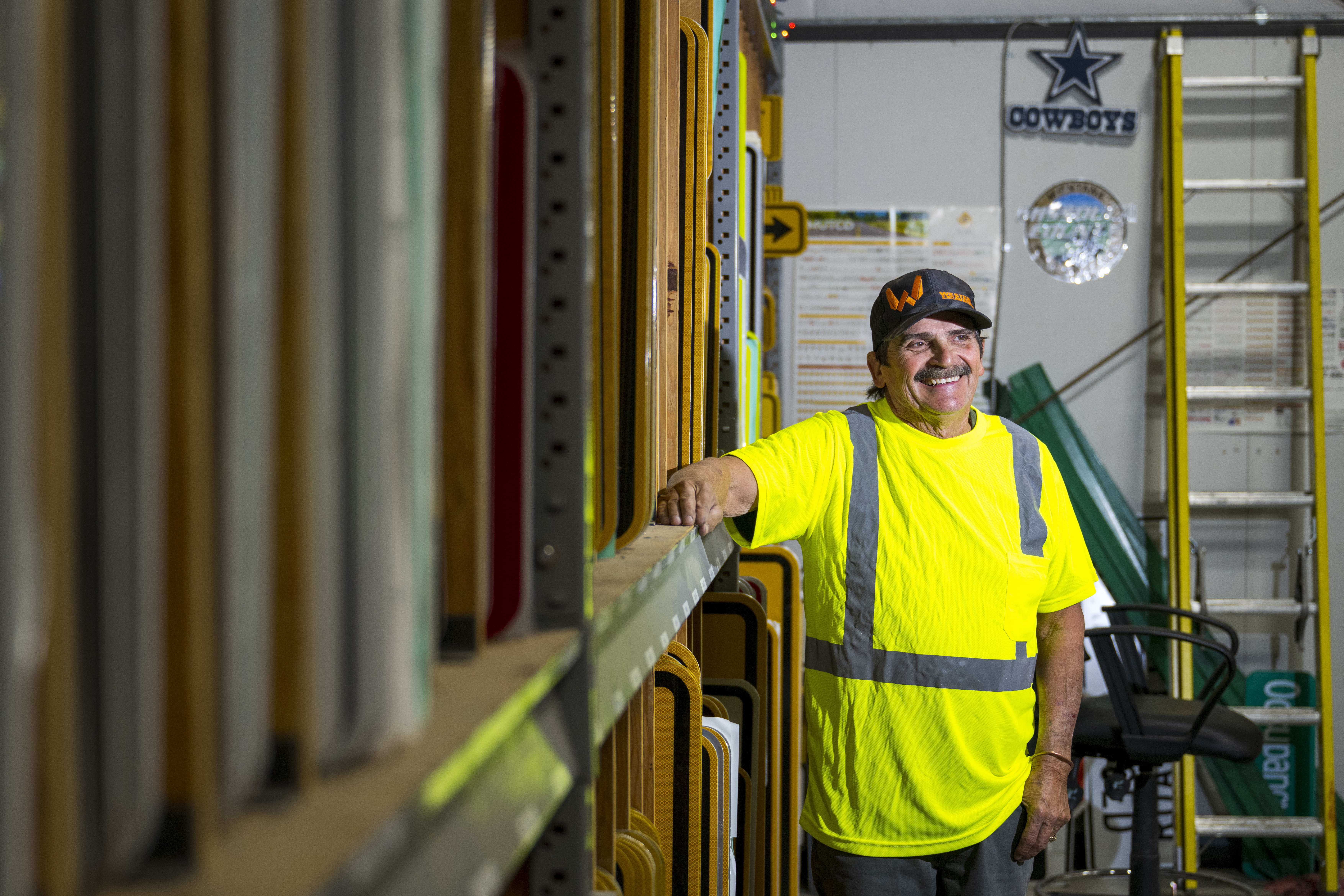 Smiling Public Works employee in the sign shop