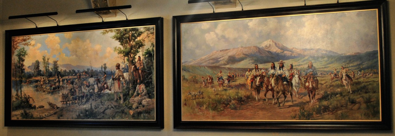 Color photo of the interior of the courthouse lobby featuring two murals painted by Edgar Paxson