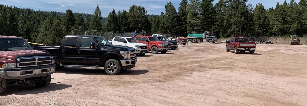 Seeley Lake Refuse District parking lot on a sunny day